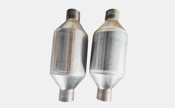 Car Catalytic Converter and Exhaust Muffler: Two cylindrical metal components designed for vehicle exhaust systems, featuring a sleek metallic finish and essential for reducing emissions.